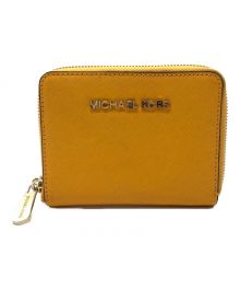 MICHAEL KORS（マイケルコース）の古着「ラウンドファスナーミニウォレット」｜イエロー