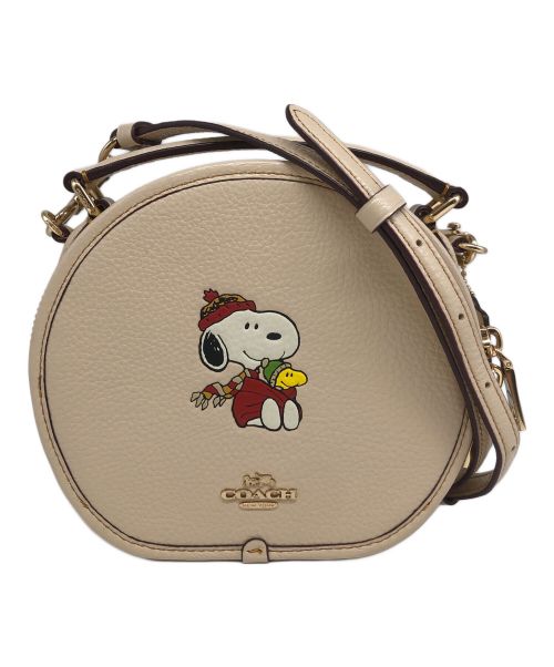 COACH（コーチ）COACH (コーチ) PEANUTS (ピーナッツ) キャンティーン　クロスボディ・スヌーピー カドル モチーフ ベージュの古着・服飾アイテム