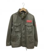 ALPHA INDUSTRIES×STRICT-Gアルファインダストリーズ×ストリクトジー）の古着「M-65 フィールドジャケット 機動戦士ガンダム ランバ・ラル隊モデル」｜オリーブ