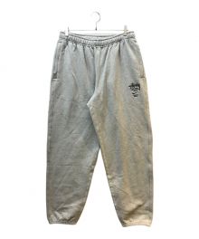 NIKE × STUSSY（ナイキ × ステューシー）の古着「インターナショナルスウェットパンツ」｜グレー