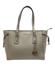 MICHAEL KORS（マイケルコース）の古着「チャーム付きハンドバッグ」｜ベージュ