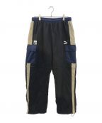 PUMA×X-LARGEプーマ×エクストララージ）の古着「2WAY NYLON TRACK PANTS」｜ネイビー×ベージュ