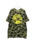 A BATHING APE（アベイシングエイプ）の古着「コラボカモ柄プリントTシャツ」｜オリーブ