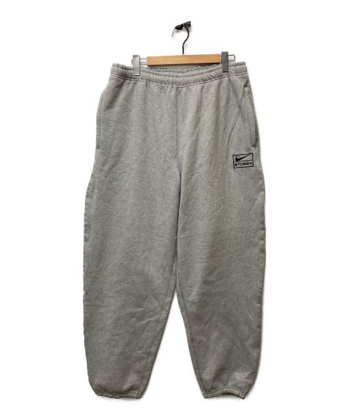 NIKE（ナイキ）NIKE (ナイキ) stussy (ステューシー) コラボスウェットパンツ グレー サイズ:L 未使用品の古着・服飾アイテム