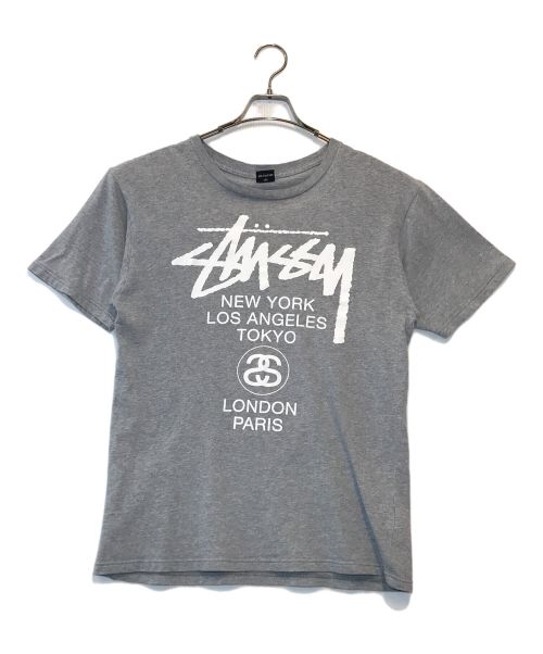 stussy（ステューシー）stussy (ステューシー) ワールドツアーTシャツ グレー サイズ:MEDIUMの古着・服飾アイテム