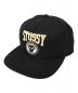 stussy（ステューシー）の古着「Goldie Metalheadz コラボキャップ」｜ブラック