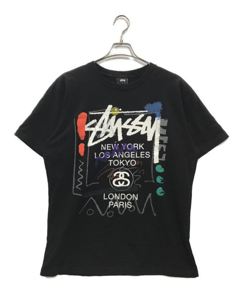 stussy（ステューシー）stussy (ステューシー) ワールドツアープリントTシャツ ブラック サイズ:Lの古着・服飾アイテム