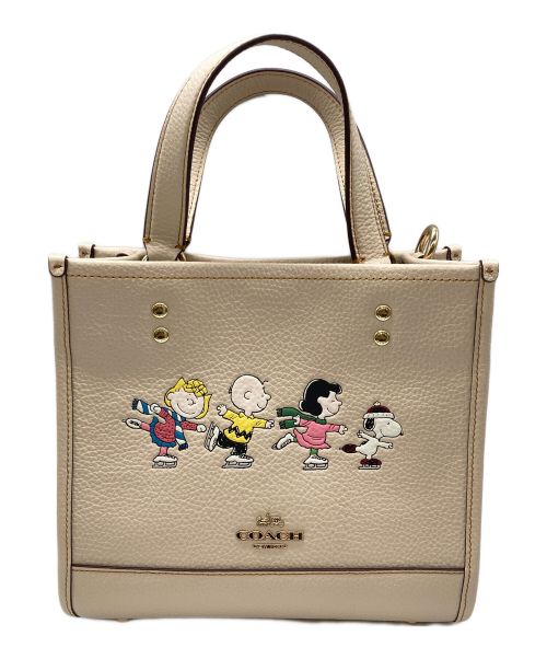 COACH（コーチ）COACH (コーチ) PEANUTS (ピーナッツ) デンプシー トート 22・スヌーピー アンド フレンズ モチーフ ベージュの古着・服飾アイテム