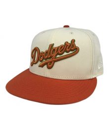 New Era（ニューエラ）の古着「キャップ」｜オレンジ