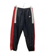 NIKEナイキ）の古着「WOVEN RE ISSUE PANT」｜ブラック×レッド