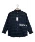 uniform experiment（ユニフォームエクスペリメント）の古着「FLANNEL CHECK GOTHIC LOGO BAGGY SHIRT」｜グリーン