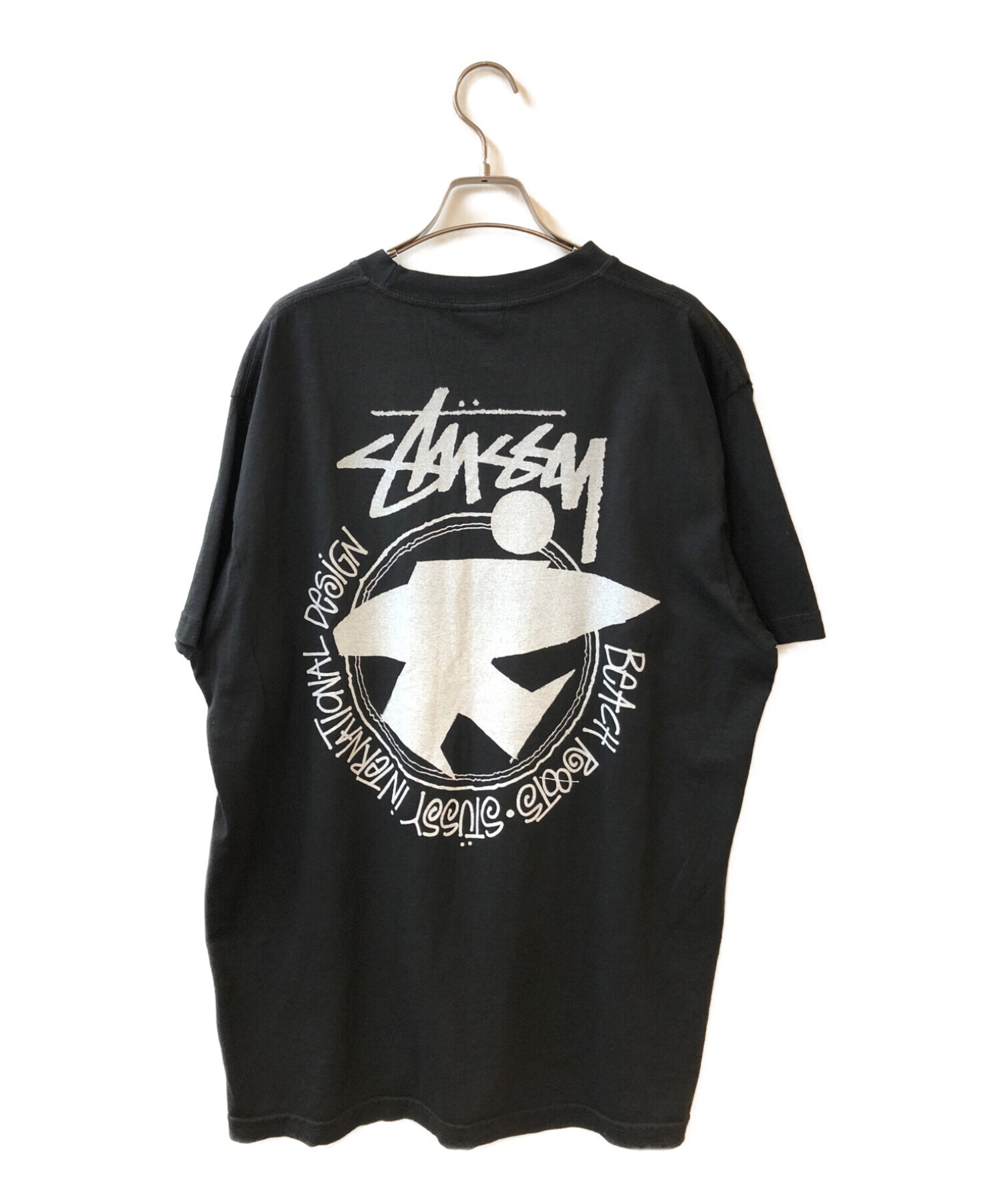 stussy (ステューシー) 復刻サーフマンプリントTシャツ ブラック サイズ:Ⅼ