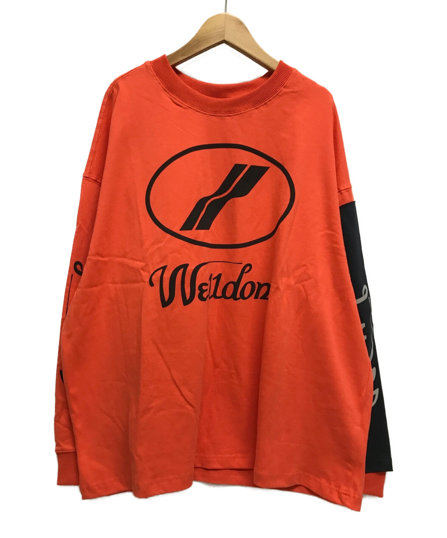 WE11DONE (ウェルダン) Remake L/S ロゴ Tシャツ オレンジ サイズ:S