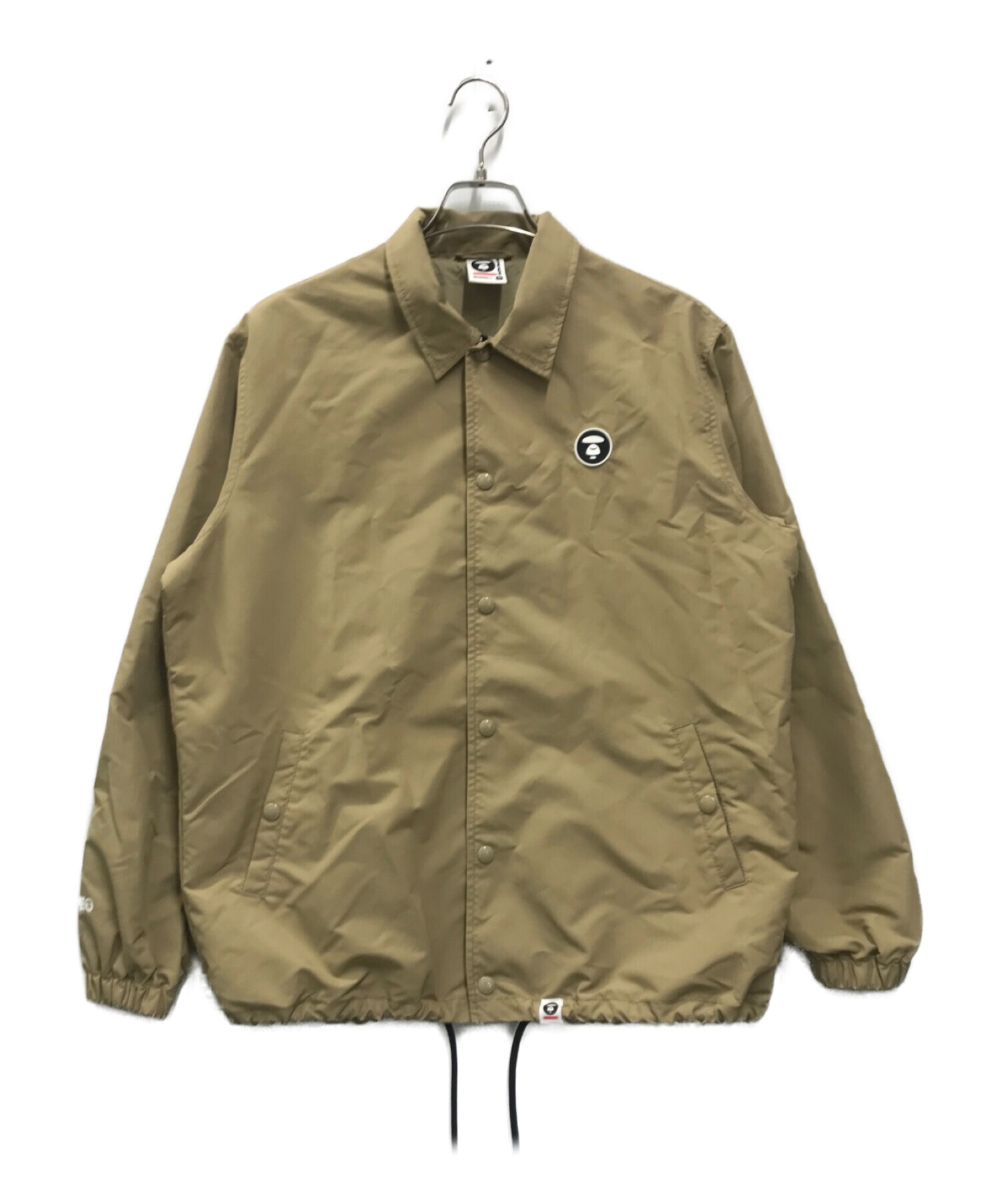 中古・古着通販】AAPE BY A BATHING APE (エーエイプ バイ アベイシングエイプ) ナイロンコーチジャケット ベージュ  サイズ:S｜ブランド・古着通販 トレファク公式【TREFAC FASHION】スマホサイト