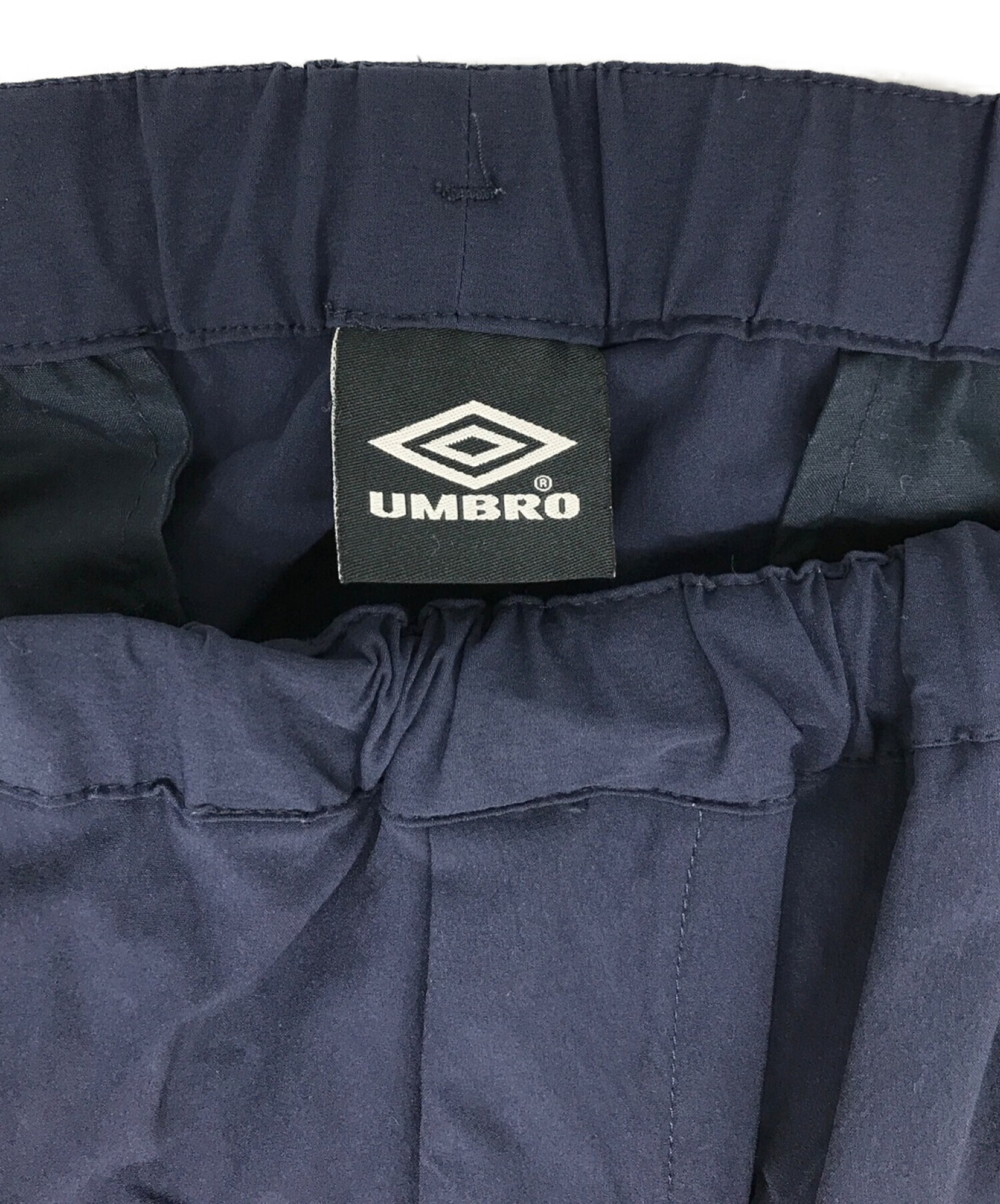 UMBRO (アンブロ) BEAUTY&YOUTH (ビューティーアンドユース) 別注ナイロントラックパンツ ネイビー サイズ:L