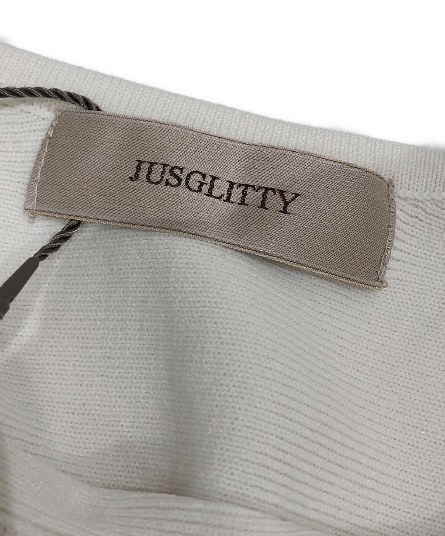 JUSGLITTY (ジャスグリッティー) ペプラムニットプルオーバーシャツ オフホワイト サイズ:2 未使用品